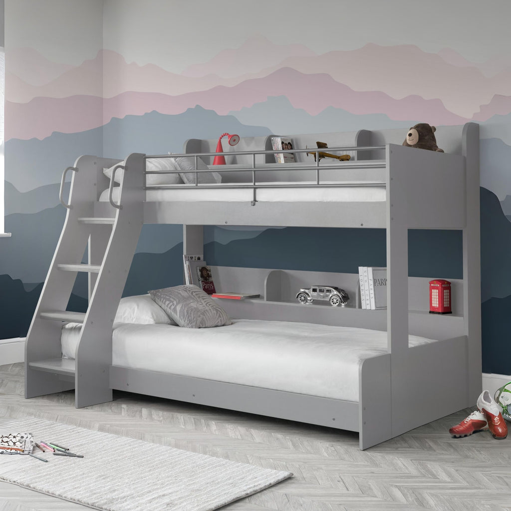Gray bunk bed in a room with a mountain mural on the wall.